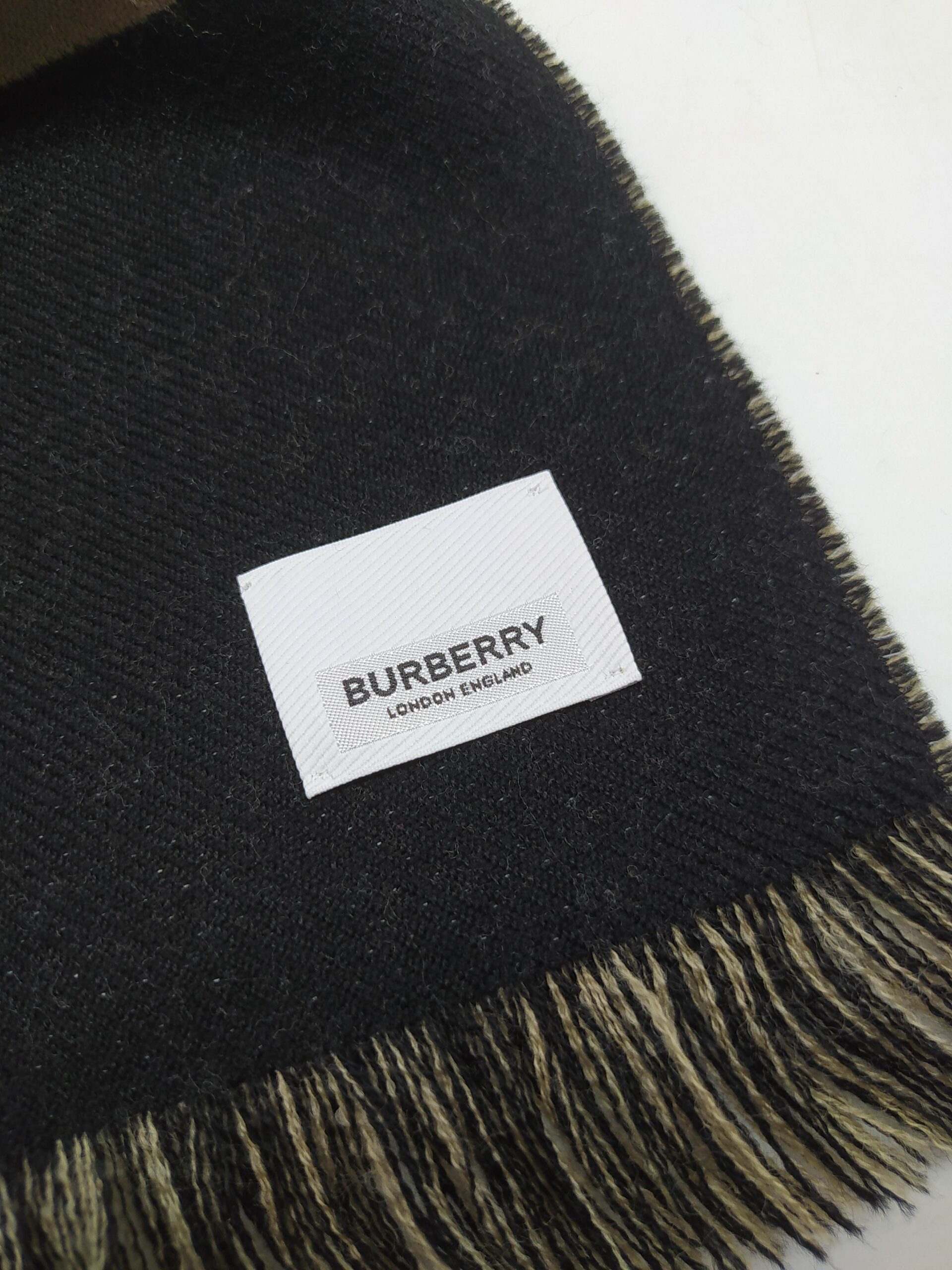 black and beige Burberry scarf